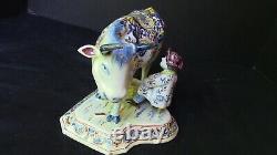 A lovely Dutch Delft Polychrome Cow With Milker