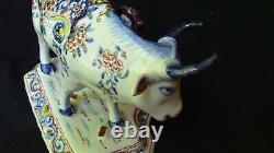 A lovely Dutch Delft Polychrome Cow With Milker